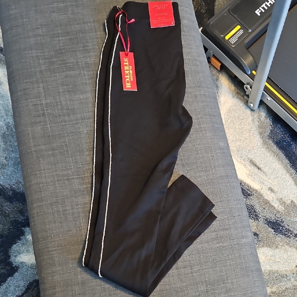Jennifer Lopez Black Straight legging fit with rhinestones on the sides.